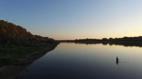 Fisherman on the river in sunset Stock-Footage 56303239