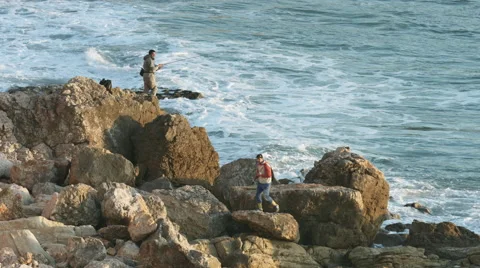 Fisherman on the rock - Tonel beach Stock Footage 47014805
