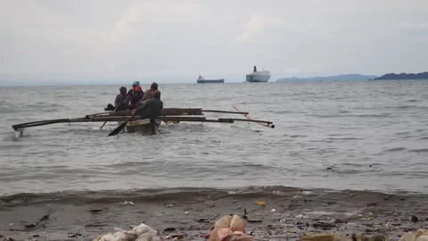 Fisherman rowing on a boat. Stock Footage 220755829
