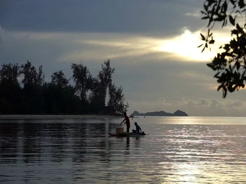 Fisherman rowing bot Stock Footage 121846473