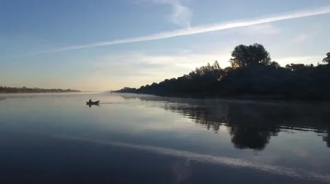 Fisherman rowing on the river Stock-Footage 56246268