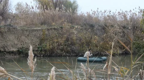 A fisherman in a rubber boat. Video stock 43801320