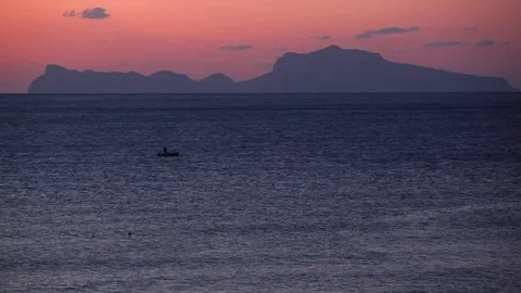 Fisherman sailing in the sunset Stock Footage 71588398