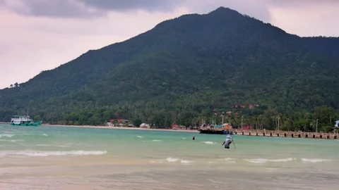 Fisherman in the sea with a fishing rod. Thailand Stock Footage