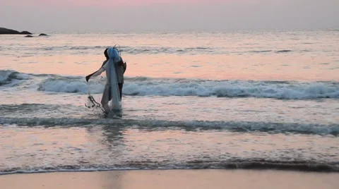 Fisherman in the sea at sunset Video stock 37348007