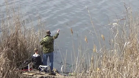 The fisherman sets up the bait Stock Footage 76698587