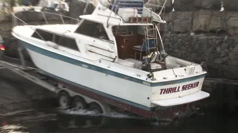 Fisherman Sets Boat into Harbor Stock Footage 22330484