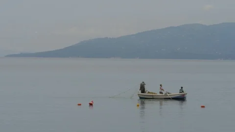 Fisherman Setting Net To Catch Fish Stock Footage 120029850