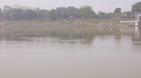 Fisherman setting nets on the Mekong river in Laos Stock Footage 24925368