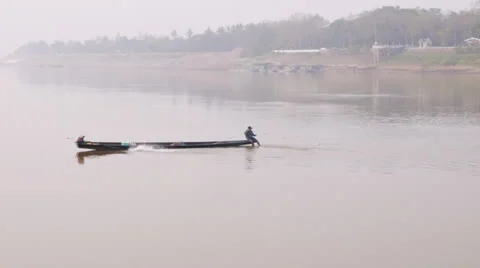 Fisherman setting nets on the Mekong river in Laos Stock Footage 24925408