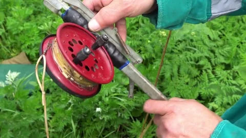 A fisherman shows a device for catching fish Stock-Footage 76207865