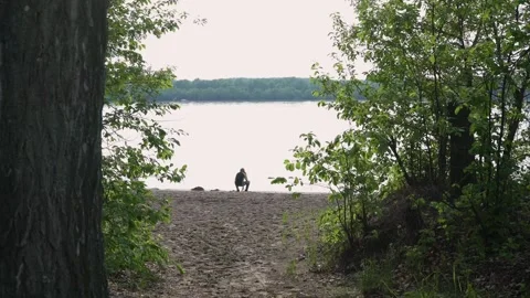 Fisherman is sitting on the beach Video stock 130572563