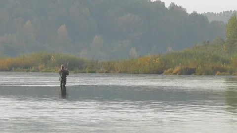 Fisherman standing in the river. Stock Footage 95482767