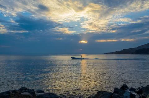 Fisherman starting work during first light Stock-Fotos