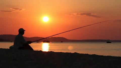 Fisherman at sunset Stock Footage 70753859