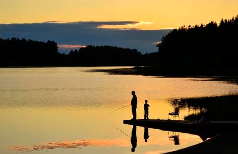 Fisherman in sunset Stock Photos