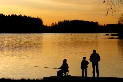 Fisherman in sunset Stock Photos