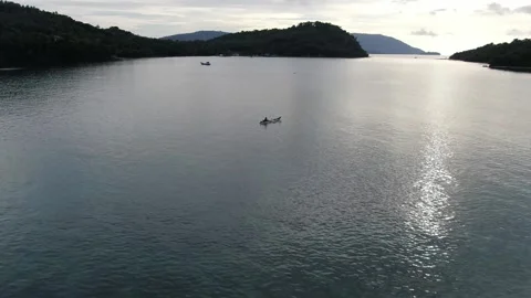 FISHERMAN ON SURFACE OF THE SEA Stock Footage 276557676