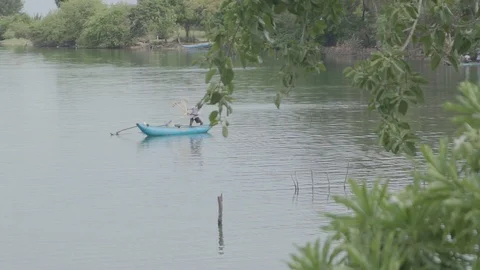 Fisherman is thoughin his net Stock Footage 105170675