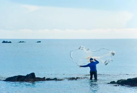 A fisherman throw the net Stock Photos