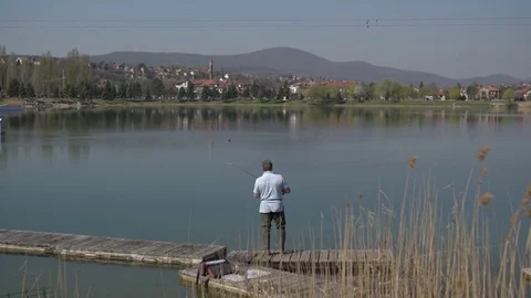 Fisherman throwing the bait Stock Footage 74023581