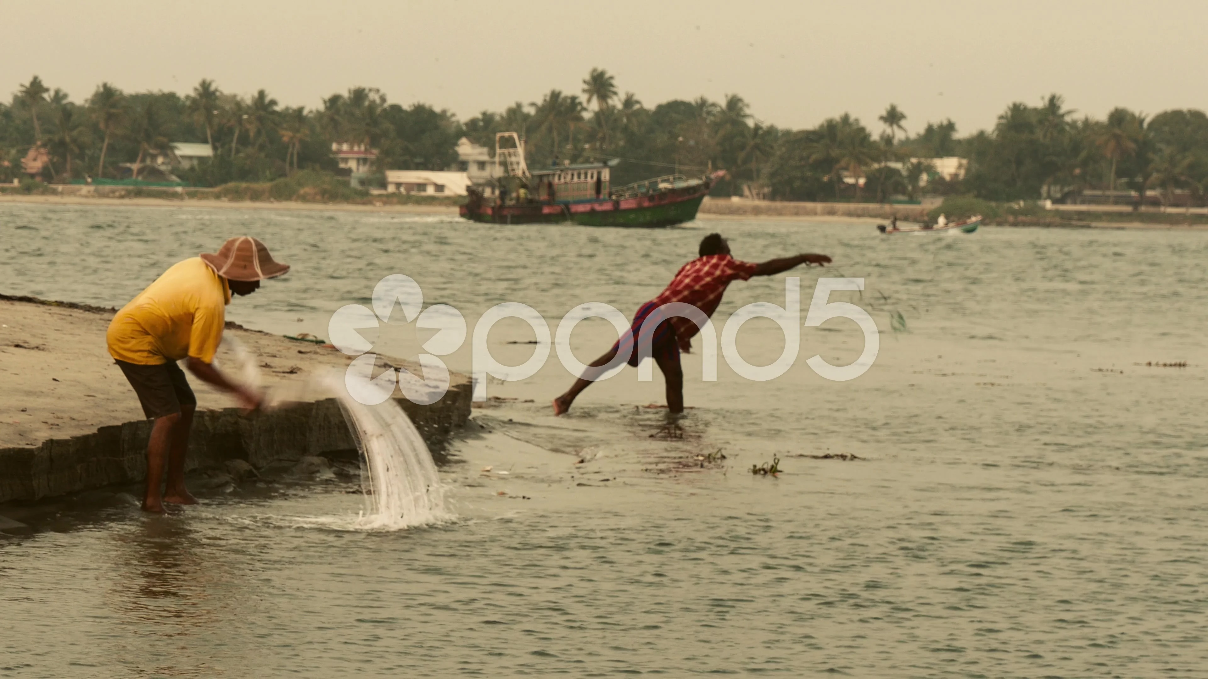 Traditional Fishing  Fisherman catching fish by net with kids 