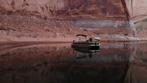 Fisherman Throws Out a Cast In Calm Water With Red Rock Sandstone Walls Lake P Stock Footage 88234424