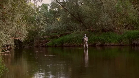 Fisherman try to catch fish on the river Protva in Russia Stock Footage 111318820