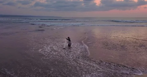 Fisherman trying to catch anythig from the ocean Video stock 124661364