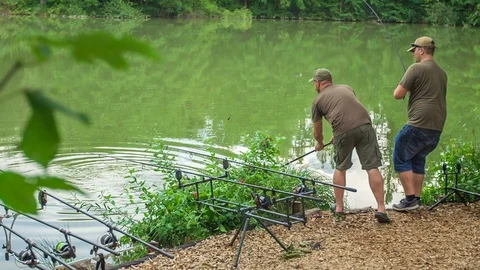 Fisherman is trying to get a net out of water Stock Footage 112173644