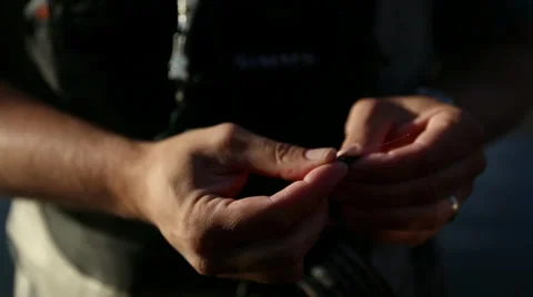 Fisherman Tying a Fly Stock Footage 35174633