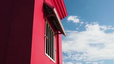 Fisherman under red lighthouse drinking water, winter sunny sea. SLOWMOTION Stock Footage 117410245
