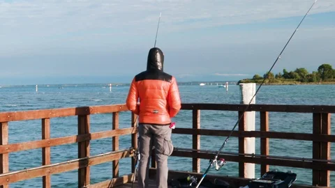 Fisherman Waiting on a Bridge - Magic River Stock Footage 117409509