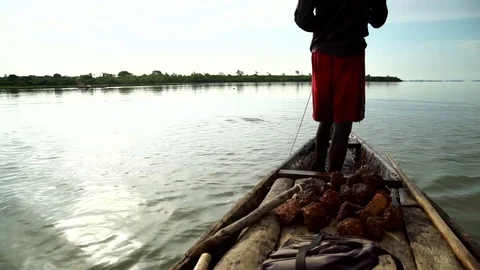 A fisherman waits in the canoe to pull out of his net. About fishing, nature Stock Footage 71497108
