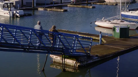 Fisherman Walk onto Docks in Harbor Stock Footage 35275377