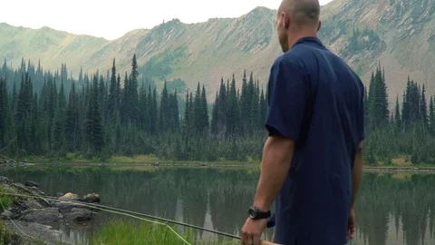 Fisherman Walk to Lake Stock Footage 84036170