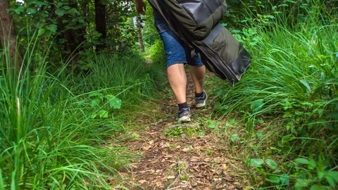 Fisherman is walking on a forest path Stock Footage 112174688