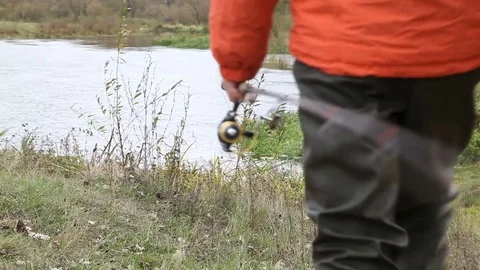 The fisherman walking to the river Stock Footage 72039978