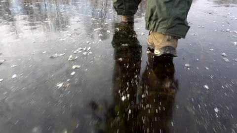 Fisherman is walking on slippery ice Video stock 101007938