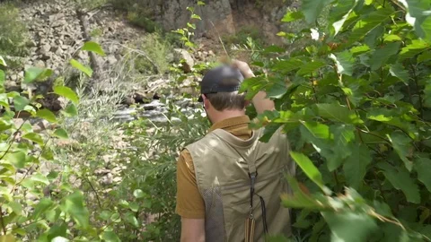 Fisherman Walks Down Path to River Video stock 122104311
