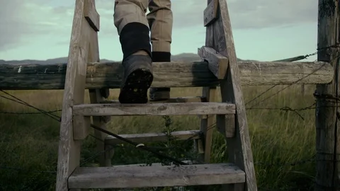 Fisherman walks through feild. Stock Footage 115441029