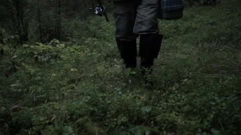 The fisherman walks through the forest Video stock 86424940