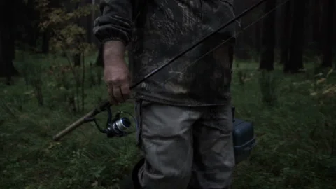 The fisherman walks through the forest 스톡 동영상 86428649