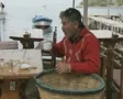 Fisherman weaving net SD Footage
