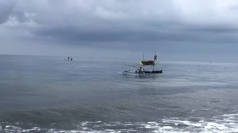 Fisherman working during cloudy days 스톡 동영상 138651328