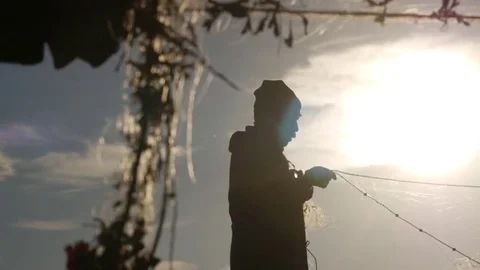 Fisherman working net sunset Stock Footage 78637677