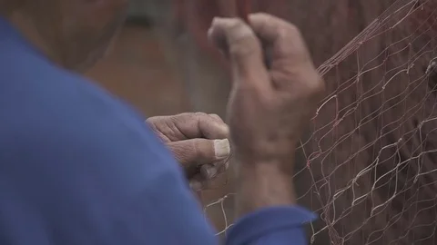 Fisherman works on web in slow motion Stock Footage 71217577