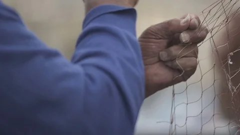 Fisherman works on web in slow motion Stock Footage 71217662
