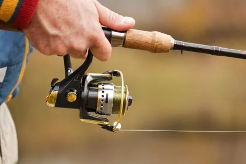 Fisherman`s hands with spinning. Foto stock