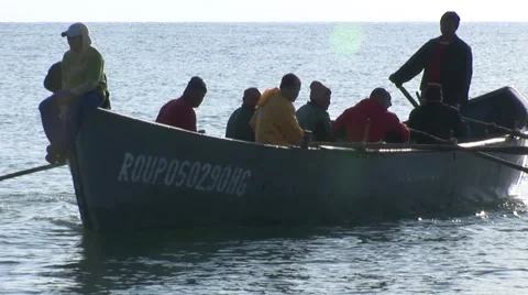 Fishermans reaching the shore Stock Footage 41212515